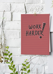 Work harder poster on white wall
