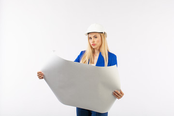 Employee woman in suit standing in helmet with paper documents