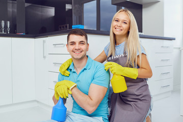 House cleaning. A young couple is cleaning an apartment.