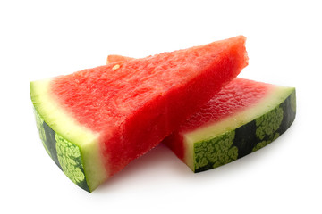 Two lying triangles of seedless watermelon isolated on white.