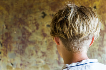 Close-up of a boy's back with modern hairstyle,cropped haircut. Concept fashion and beauty.