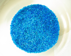 beads of silica gel to absorb moisture