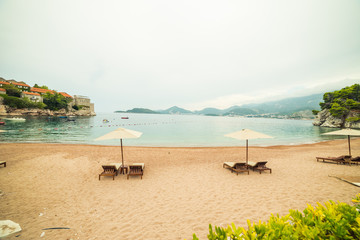 Sunbeds and umbrella on the beach