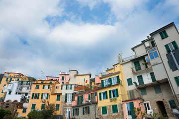 Fototapeta na wymiar Typical arhitecture and colors of terrace homes in Italian village