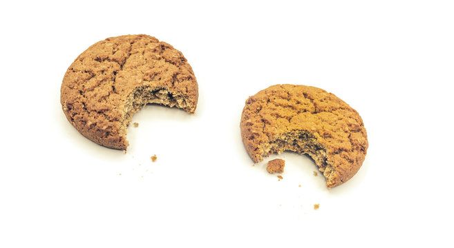 biten oatmeal cookies on white