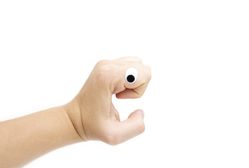 Female's hand with plastic eye on white background. Isolated on white