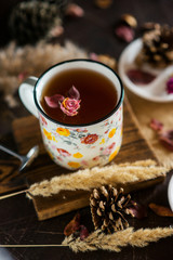 Flower tea: tea rose, petals, edible flowers, on a light background