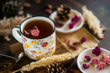 Flower tea: tea rose, petals, edible flowers, on a light background