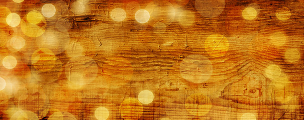 Christmas background  -  Magic bokeh lights on rustic wood texture