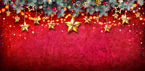 Christmas Card - Fir Garland With Hanging Stars On Red Wall

