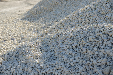 Breakstone background. Road gravel. Gravel texture. Crushed Gravel background. Piles of limestone rocks. Break stones on construction site.