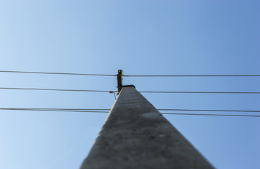 pole and wires on the sky background