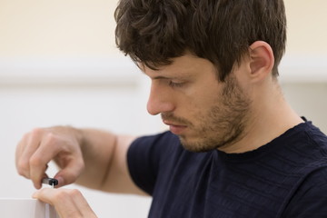Apartment-repair. Man, furniture key hexagon