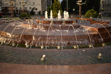 a breathtaking stream of water in a fountain;A mesmerizing beautiful round fountain with a variety of trickles of water