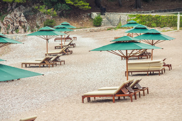 A beautiful Mediterranean beach with umbrellas and sun loungers