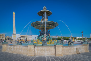Fototapeta na wymiar Paris, France - 08 18 2018: La Place de la Concorde - L'Obélisque de Louxor et la Fontaine des mers