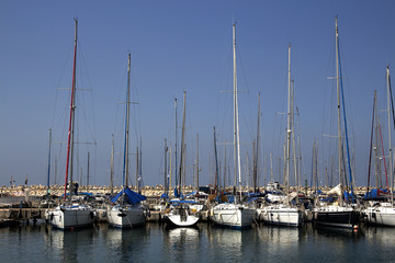 Yachts and boats in the port by the sea