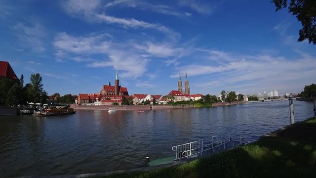 Boats with tourists on the river Odra in the center of Wroclaw. Time-lapse 4K.