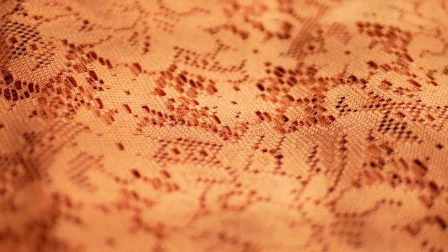 Orange fabric textile texture turns as background