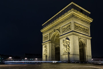 Fototapeta na wymiar Street view of Arc de Triomphe (Triumphal Arch) in Chaps Elysees at night, Paris, France.