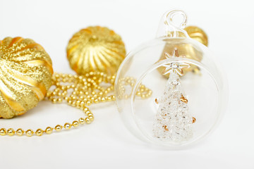 Golden New Year and Christmas balls and decoration on white background