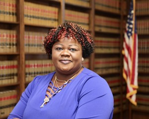Mature African American woman lawyer in law library