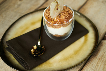 New york cheese cake dessert with mousse with apple cream, caramel, muskovado, close-up. Healthy breakfast food