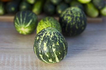 Organic tomatoes, fresh cucumber and unripe watermelon
