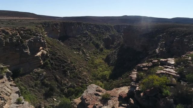 Aerial views over the town of Nieuwoudtville in the Northern Cape of South Africa with blossoming March flowers and the stunning landscape of the plato