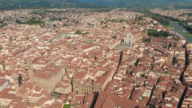 Florence aerial cityscape view on the old town with Santa Croce church and Santa Croce Plazza in Italy. 4K drone vide.