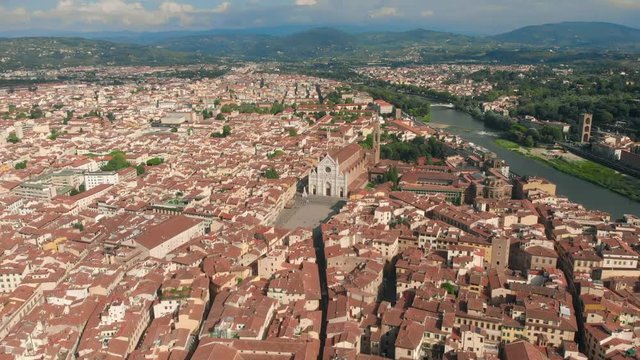 Florence aerial cityscape view on the old town with Santa Croce church and Santa Croce Plazza in Italy. 4K drone vide.