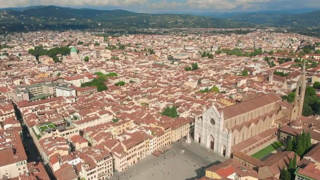 Florence aerial cityscape view on the old town with Santa Croce church and Santa Croce Plazza in Italy. 4K drone vide.