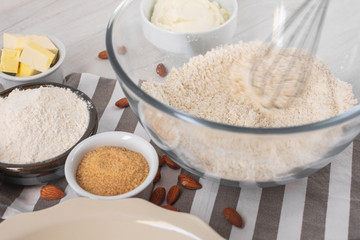 Fototapeta na wymiar Baking ingredients on kitchen table white background, top view.