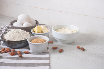 Baking ingredients and utensils on kitchen table, rustic style background.