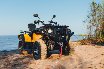quad bike ATV, blue sea background