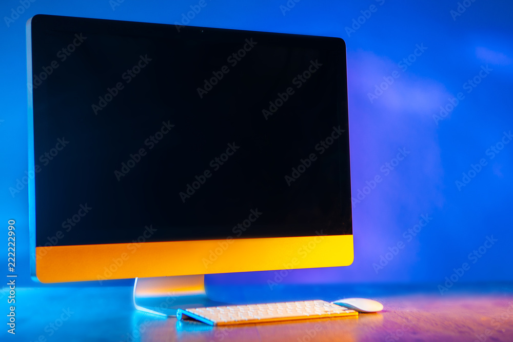 Poster large monitor. the monitor from the computer is on the table. a place for an inscription on the comp