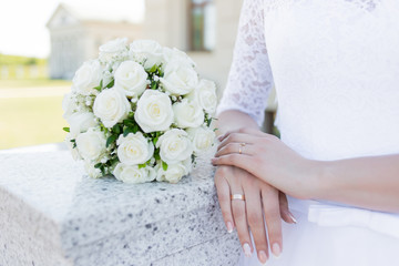 a close up of a person holding a bouquet of flowers