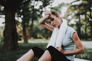 Woman in Sportswear after Yoga Exercises in Park.