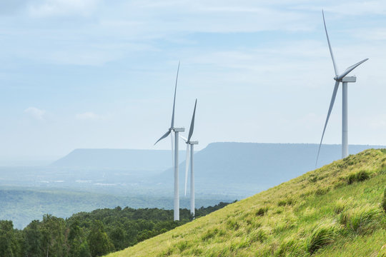 White wind turbines generating electricity in wind power station at Lam Takhong reservoir dam, Nakhon Ratchasima, Thailand