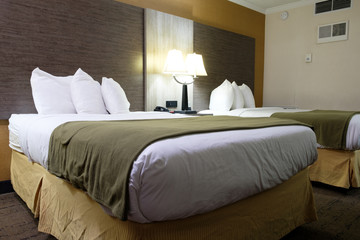 Fototapeta na wymiar Standard modern hotel room with two beds.