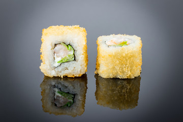 Hot roll with shrimp on black with reflection