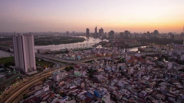 Timelapse landscape sunrise to the morning of Ho Chi Minh city or Sai Gon, Vietnam. Royalty high-quality free stock footage time lapse of center city in dawn sky.  Timelapse or time lapse is fast