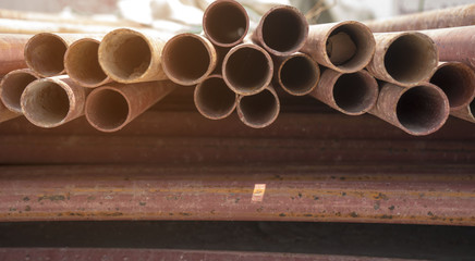 Red round steel pipe used for construction.
