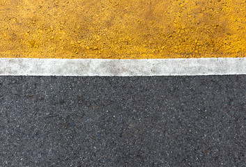 Fototapeta premium Background of yellow black strips . Dark grey asphalt road divided by yellow paint. yellow black background. using for book cover or your design..