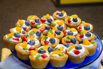 Fruit torte cups served on a plate for a special event.