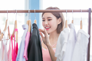 woman choosing clothes in showroom