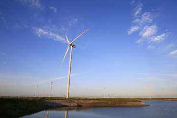 Fototapeta premium Windmill in the blue sky background