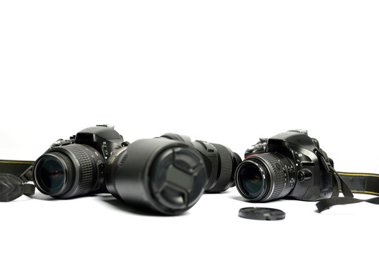 Digital SLR Camera and lens isolated on white background
