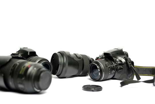 Digital SLR Camera and lens isolated on white background
