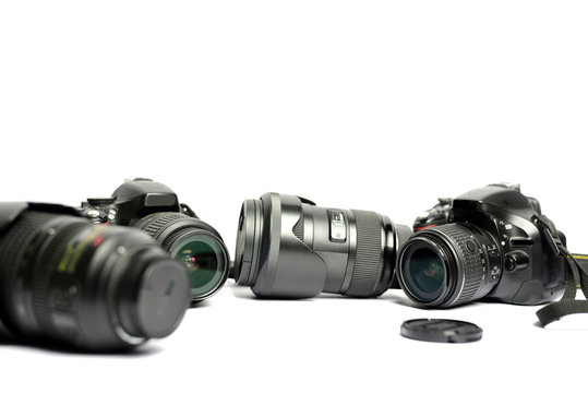 Digital SLR Camera and lens isolated on white background
